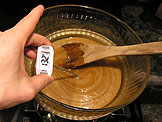 Stir until mixture is shiny and warm to the touch, about 130 degrees
